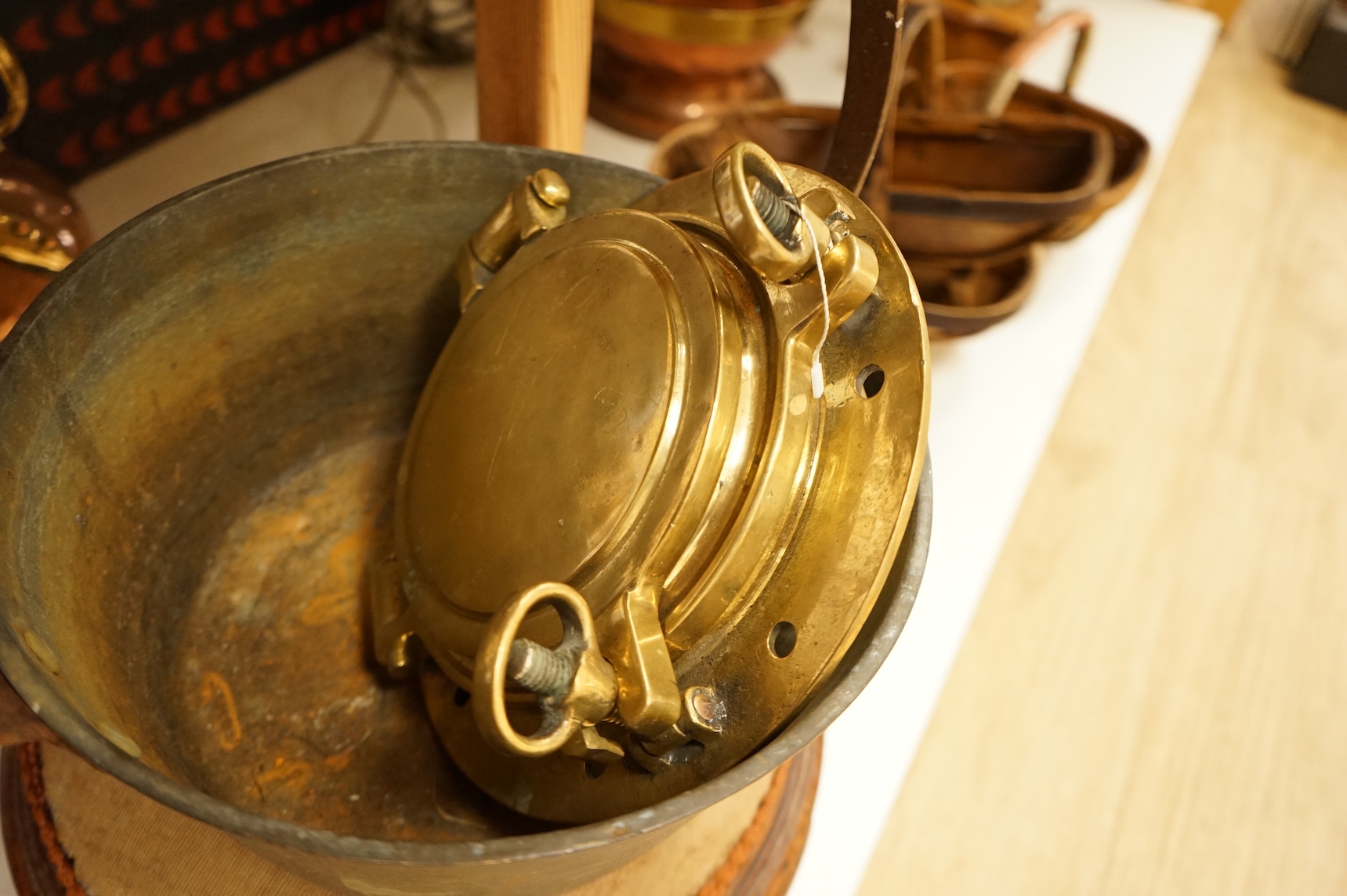 Assorted Victorian and later copper and brassware including two ships portholes, copper kettle pots, etc (16). Large porthole 36cm diameter